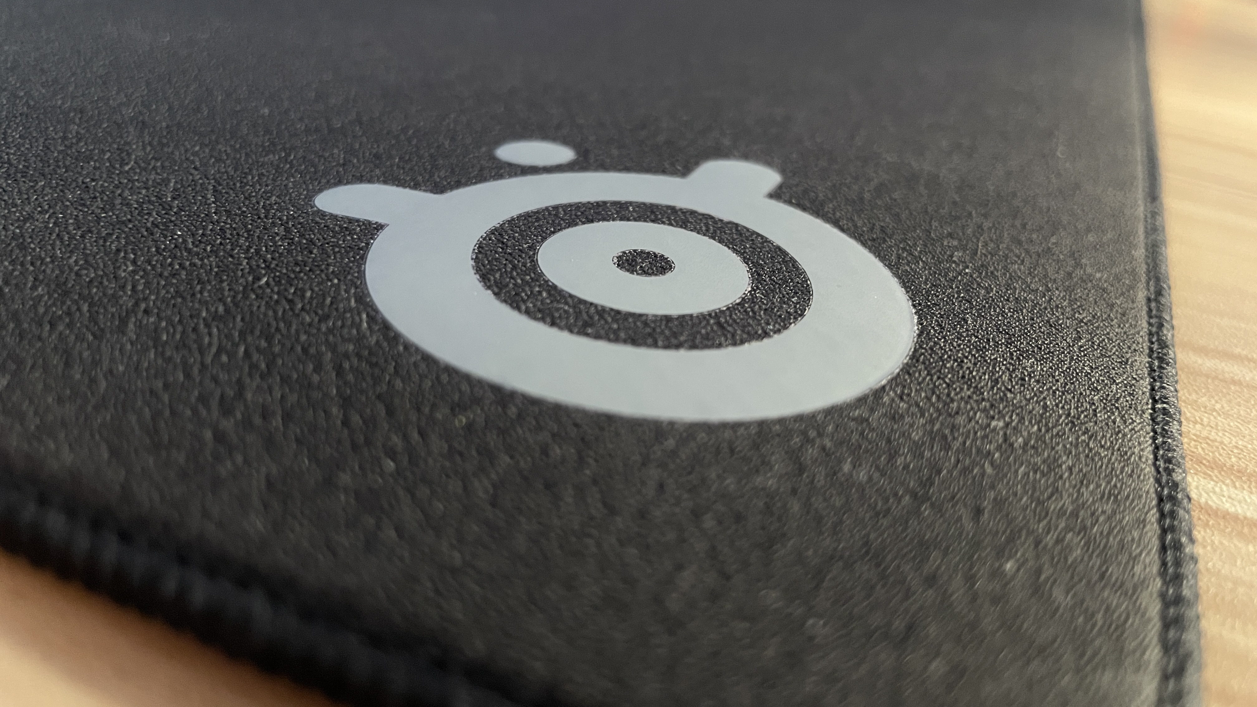 SteelSeries QcK Performance mouse pad close-up on logo