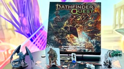The Pathfinder Quest board game box and time dragon mini