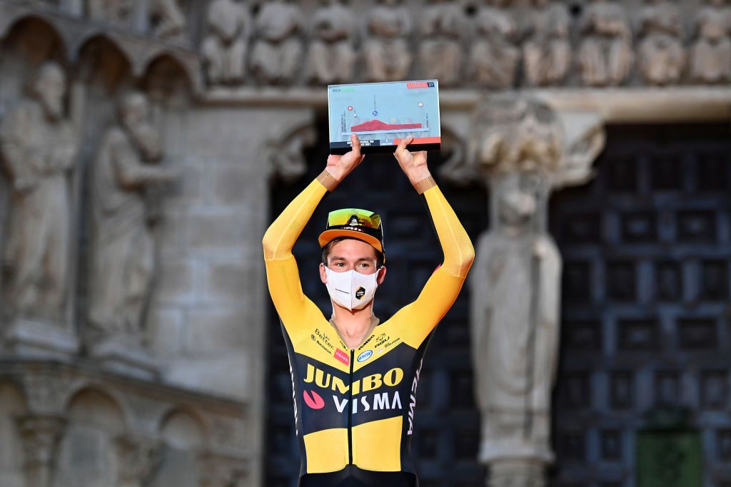 BURGOS SPAIN AUGUST 14 Primoz Roglic of Slovenia and Team Jumbo Visma celebrates winning on the podium ceremony after the 76th Tour of Spain 2021 Stage 1 a 71km individual time trial from Burgos Catedral de Santa Mara to Burgos lavuelta LaVuelta21 CapitalMundialdelCiclismo catedral2021 on August 14 2021 in Burgos Spain Photo by Stuart FranklinGetty Images