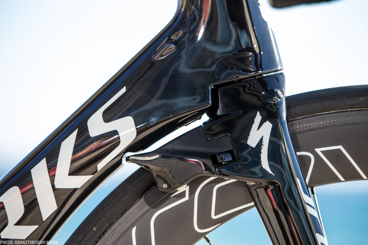 The front brake is tucked away behind the fork.
