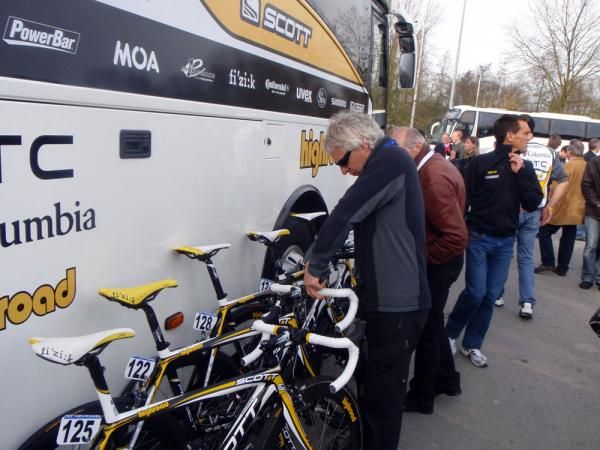 An HTC-Columbia mechanic makes some final adjustments to the riders' Scotts