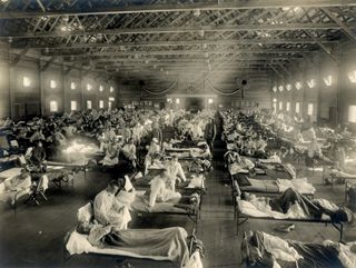 Beds with patients in an emergency hospital in Camp Funston, Kansas, in the midst of the Spanish flu pandemic.