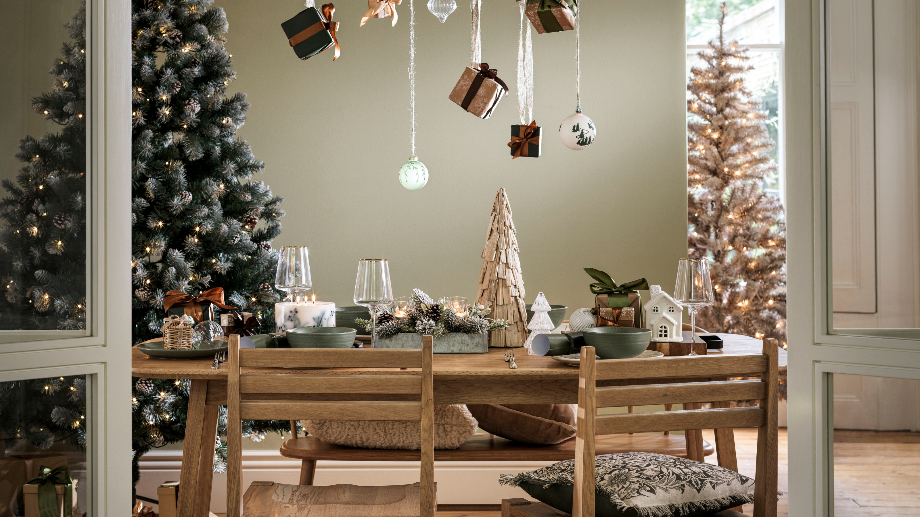 Habitat inclusion candle on a Christmas tablescape.