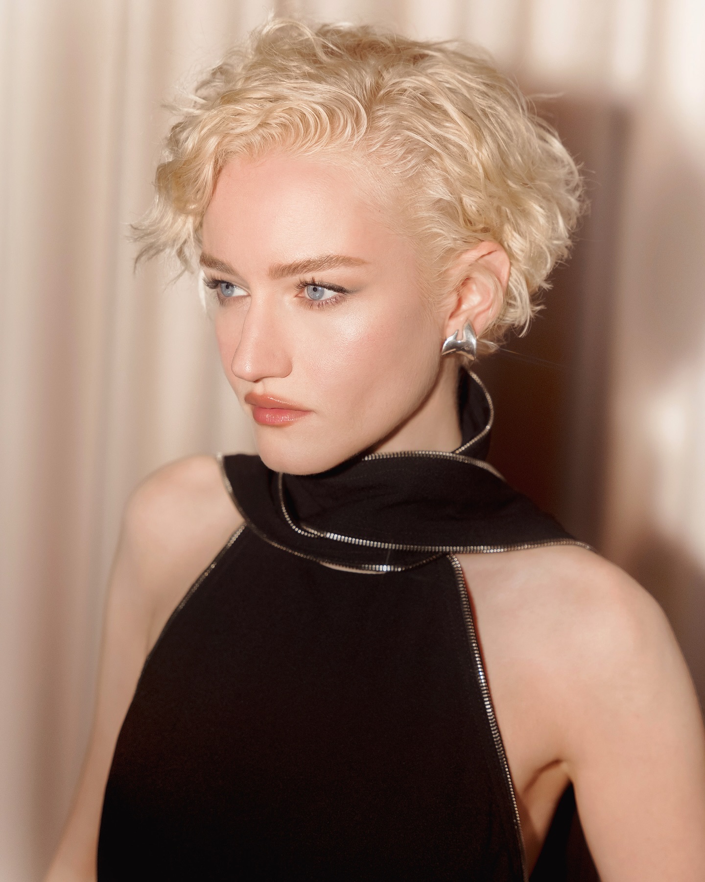 Julia Garner with platinum blonde hair