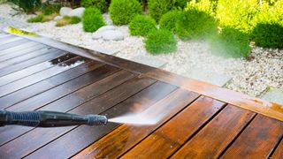 Jet washing a decking area