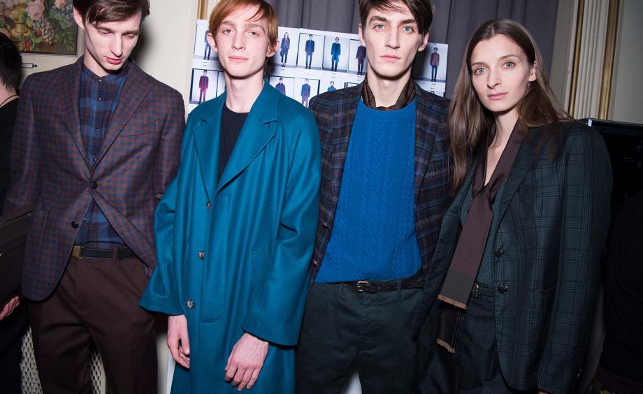 3 male models & 1 female model wearing dark colours