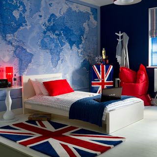bedroom with map print wall and Union Jack accessories