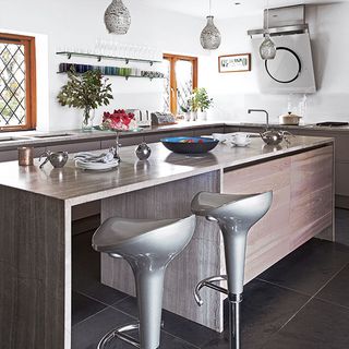 kitchen room with grey tiled flooring and white walls