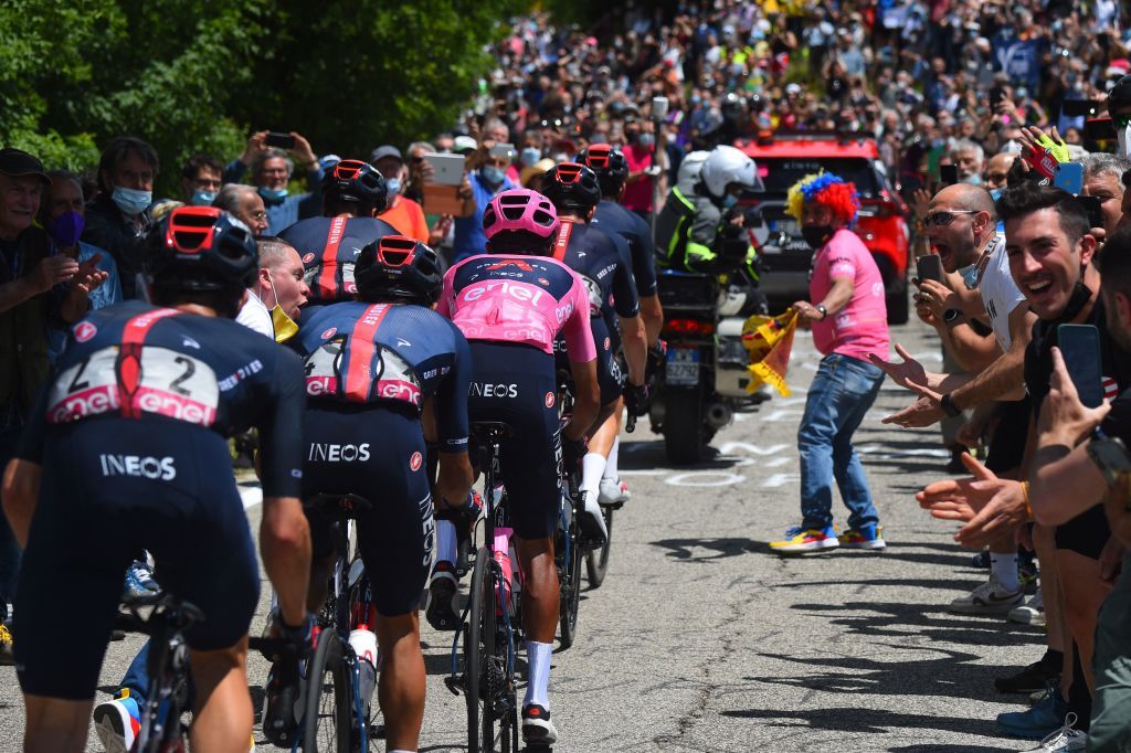Spectators cheer as overall leader Team Ineos rider Colombias Egan Bernal C and the pack ride through Monte Morello near Florence Tuscany during the twelfth stage of the Giro dItalia 2021 cycling race 212 km between Siena and Bagno di Romagna on May 20 2021 Photo by Dario BELINGHERI AFP Photo by DARIO BELINGHERIAFP via Getty Images