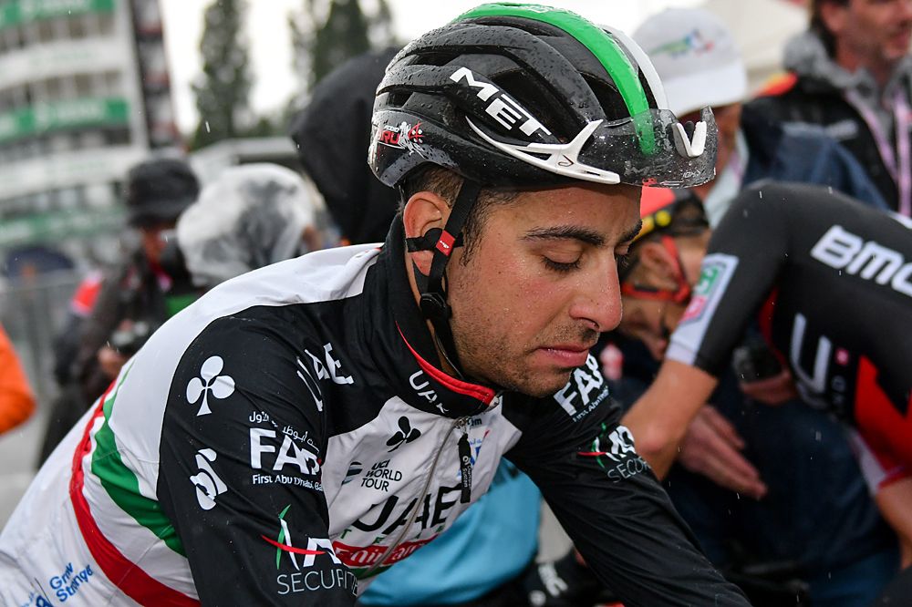 Fabio Aru (UAE Team Emirates) rolls through the finish line, cold and wet, after stage 12 of the Giro d'Italia