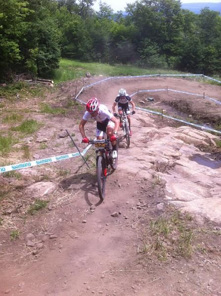 Christoph Sauser (Specialized) leads another rider on a bermy section