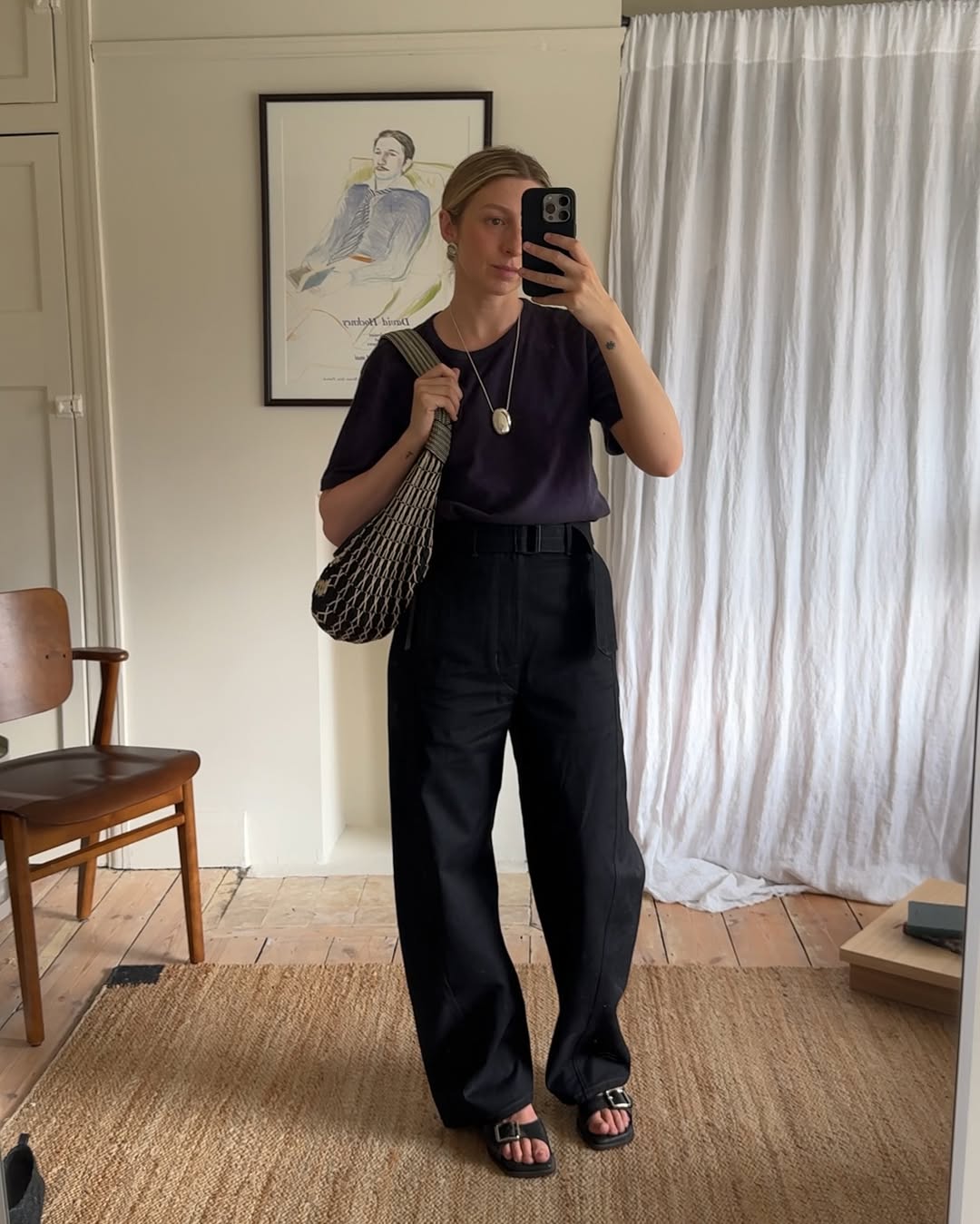 @brittanybathgate wearing black sandals and trousers