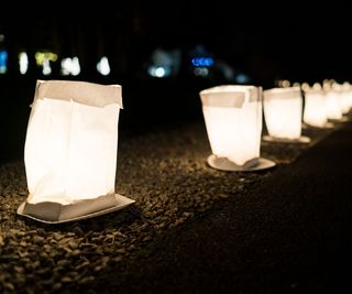 A path lit with candles and lanterns