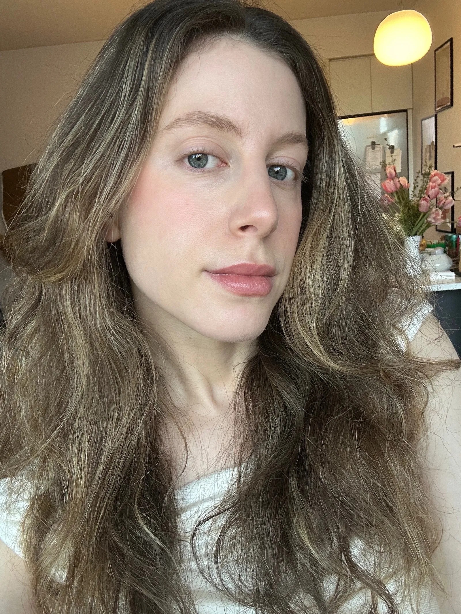 Senior beauty editor Jamie Schneider wears the Westman Atelier Baby Cheeks Blush Stick in Chouchette.