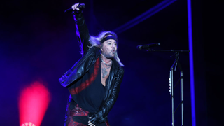 Vince Neil performing with Motley Crue