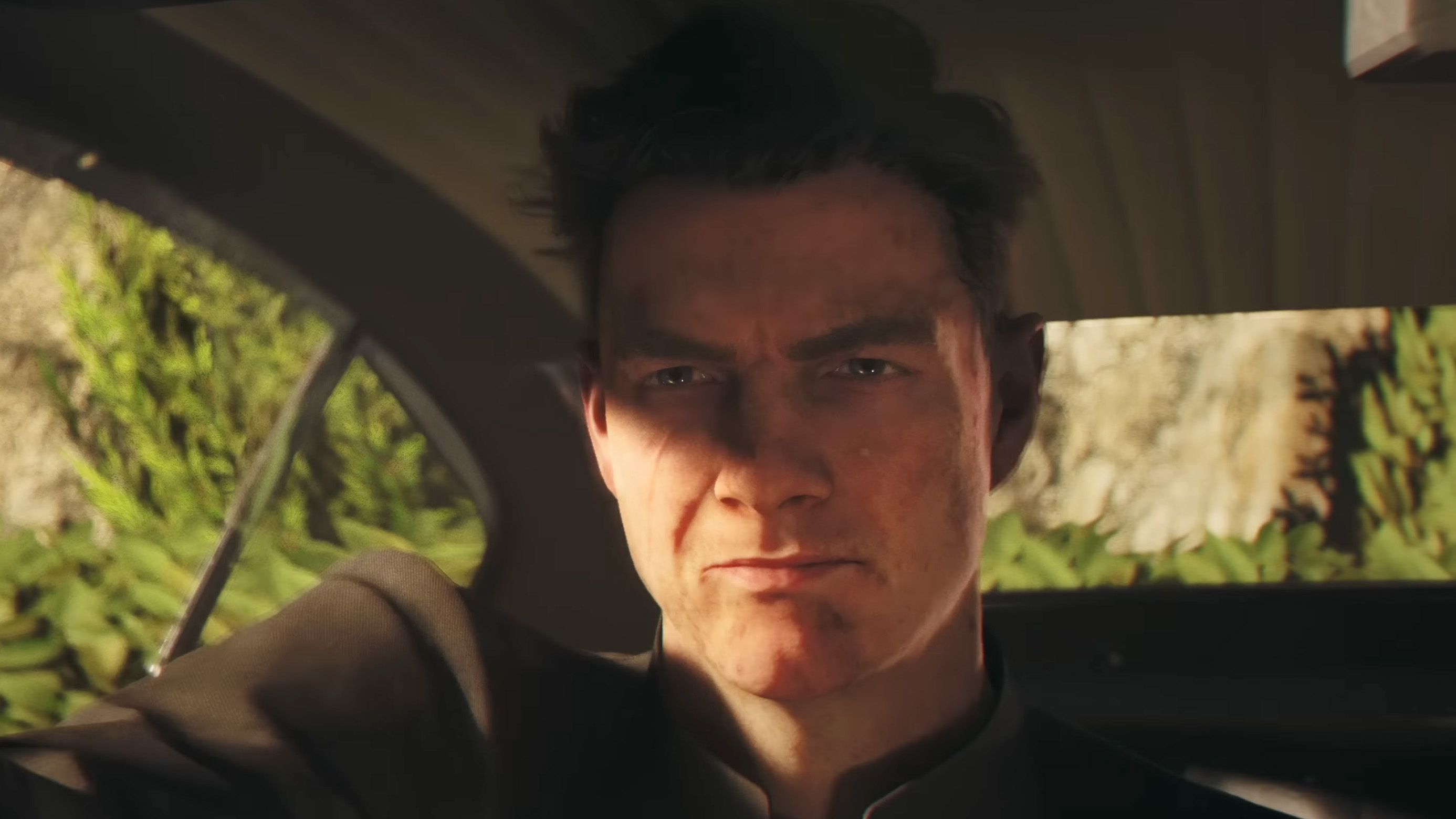 A young James Bond in 007 First Light furrowing his eyebrows. His face is dirty and he&#039;s in a car with a busted out window