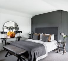 grey and white loft bedroom with hotel style bed