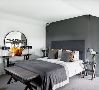 grey and white loft bedroom with hotel style bed