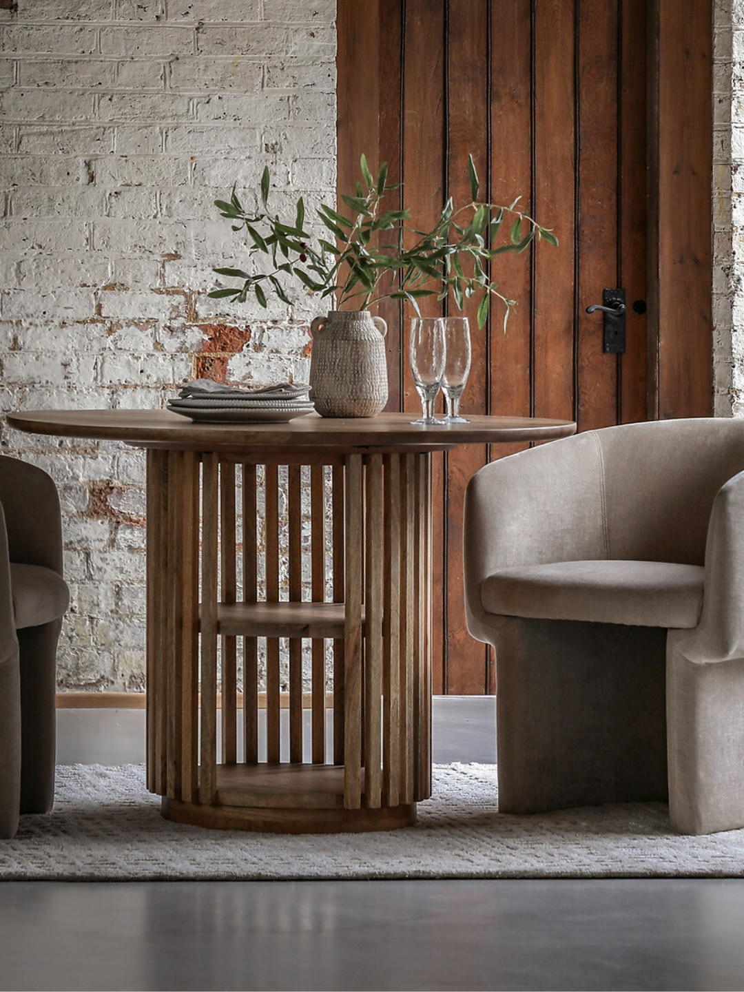 A wooden dining table with storage shelves