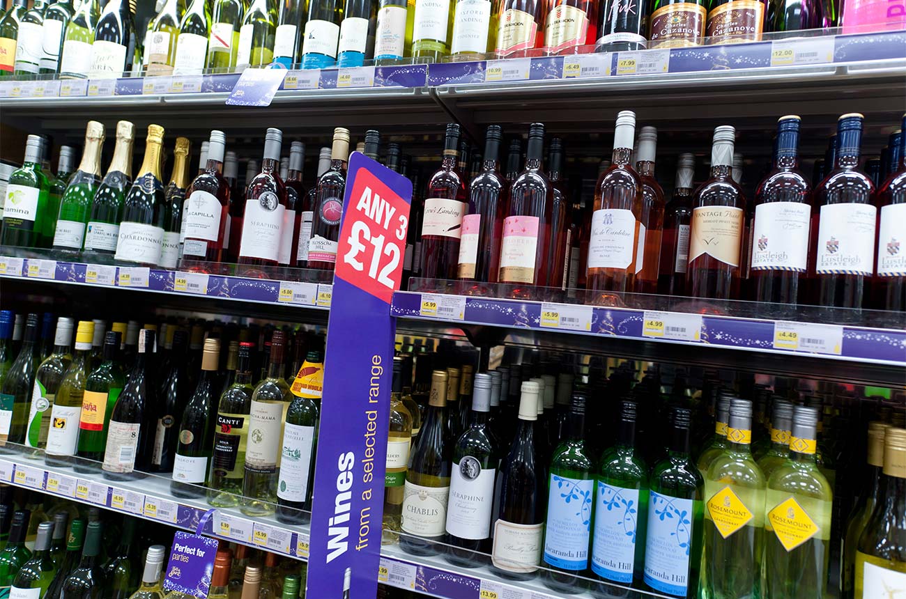 Bottles of wine on a supermarket shelf