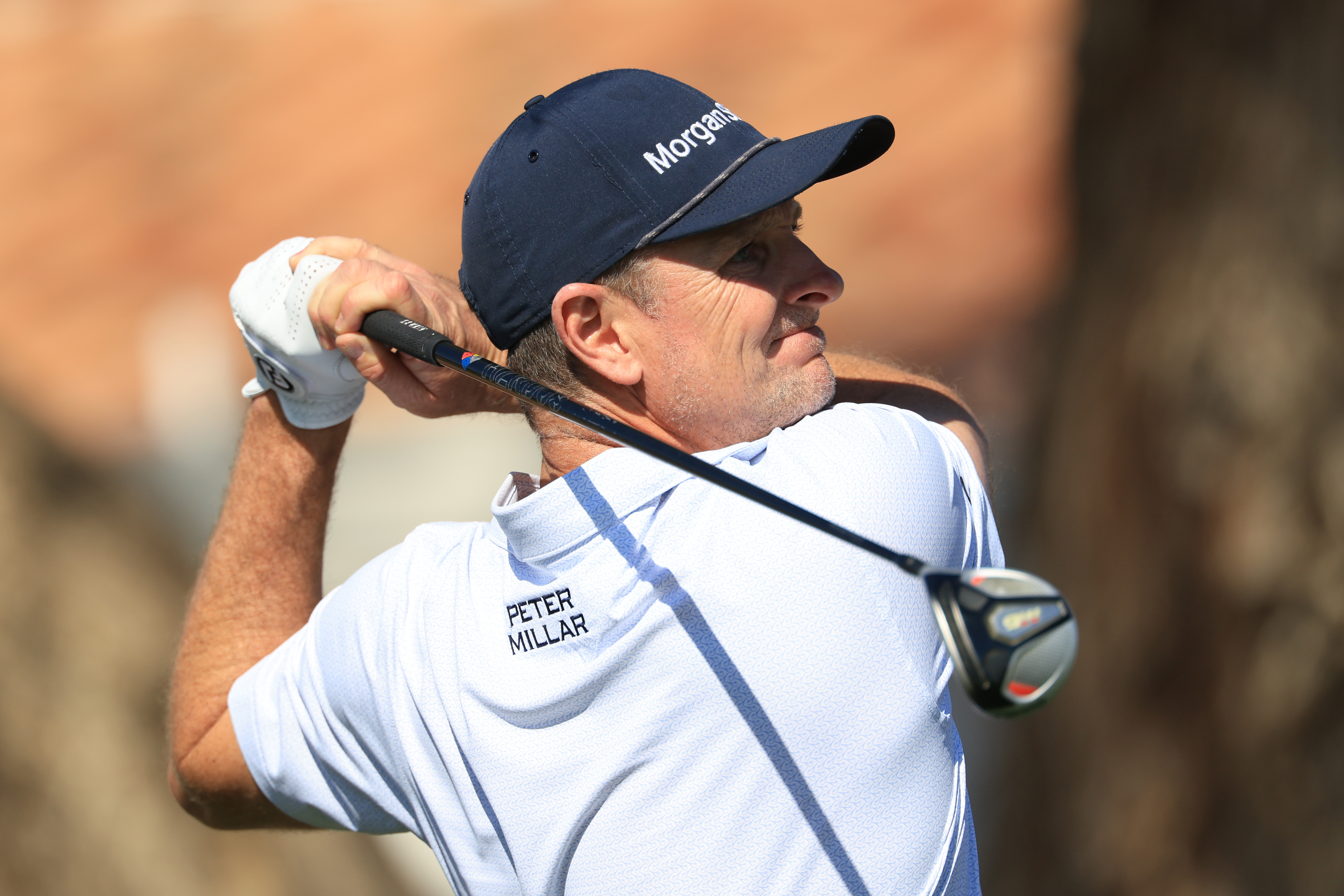 Justin Rose hits a fairway wood off the tee