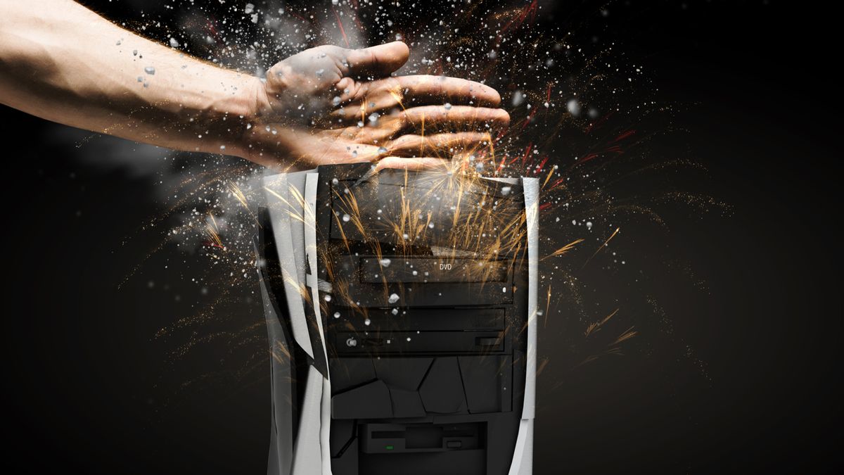 Hand smashing a desktop PC