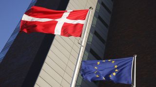 The European Union flag and the Danish national flag side by side.
