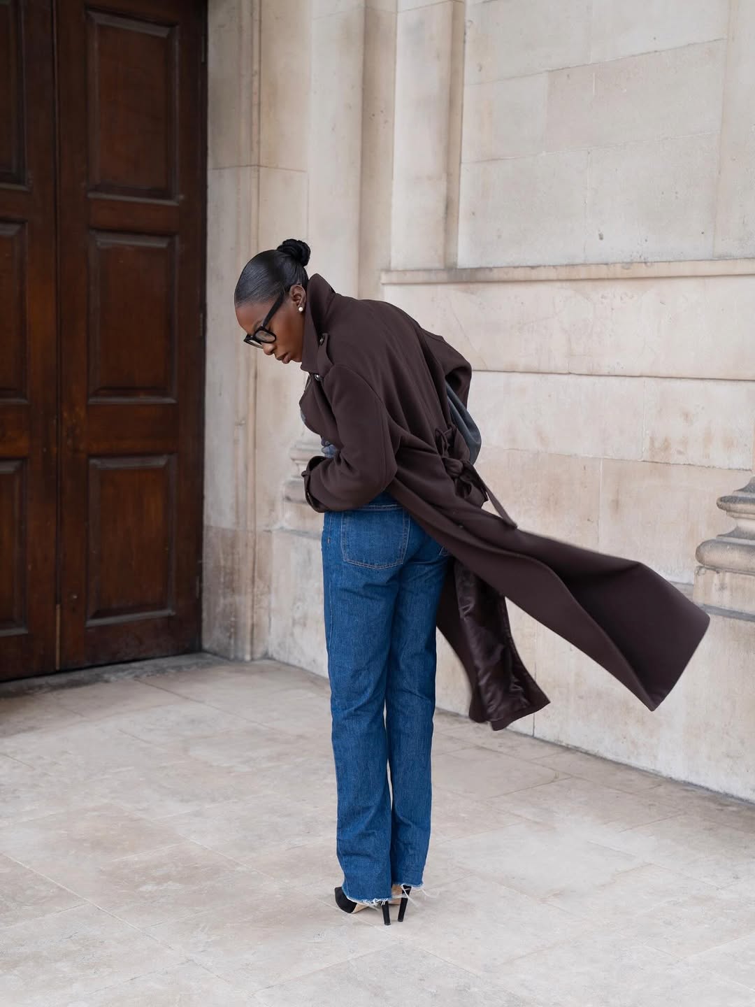 woman wearing heels with jeans spring outfit 2026