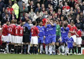 Chelsea players walk through a guard of honour in 2005