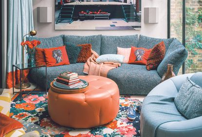 cozy living room ideas with blue sofa and red cushion