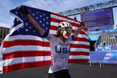 Kristen Faulkner celebrates winning the Paris Olympics road race