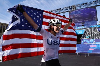 Kristen Faulkner celebrates winning the Paris Olympics road race