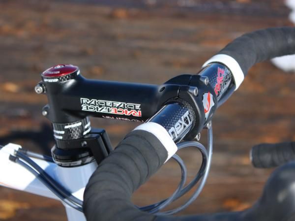 The Race Face cockpit consists of a Revolution aluminum stem clamped around a Next SL carbon bar.