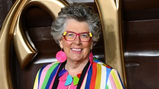 Bake Off judge Prue Leith arrives at the "Wonka" World Premiere at The Royal Festival Hall in bright jacket and bold glasses 