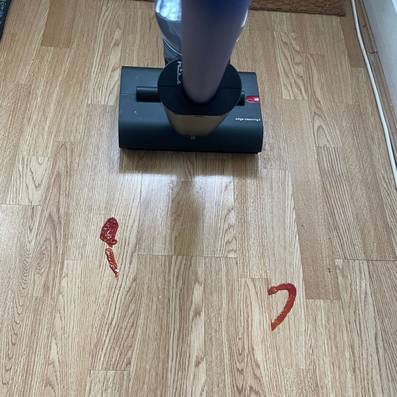 Dyson WashG1 cleaning ketchup off the floor