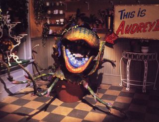 The talking plant Audrey II is shown in a shot from Little Shop of Horrors
