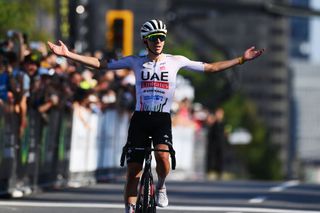 Tadej Pogacar celebrates at finish line as race winner during the 13th Grand Prix Cycliste de Montreal 2024