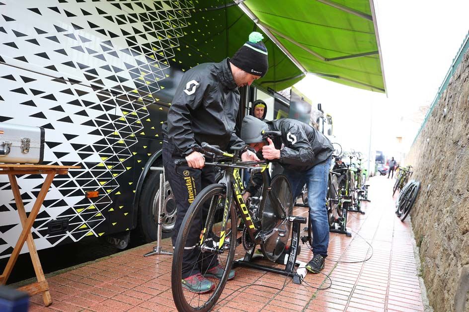 The Mitchelton-Scott riders prepare the bikes
