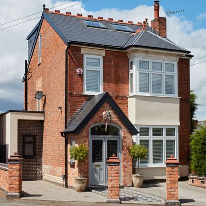 Exterior of house with brick porch