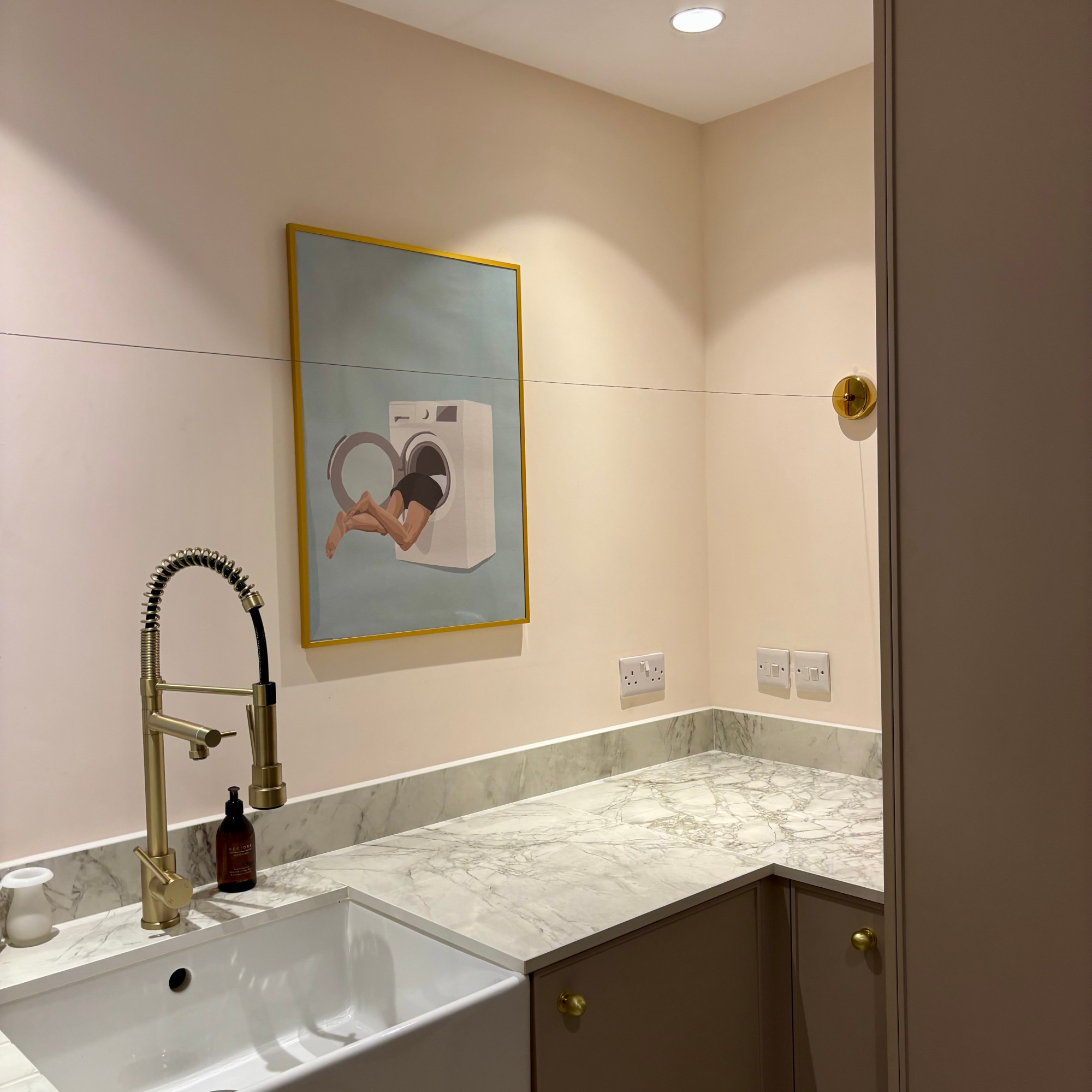 brass retractable washing line in a utility room