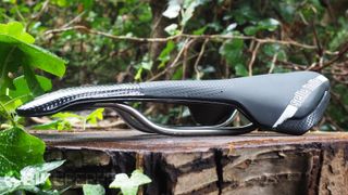 A side-on view of the Selle Italia X-LR TI316 Superflow saddle, showing off its thin racey profile