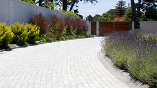 Curved block paving driveway leasing to gate