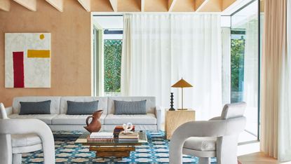 White sheer curtains around corner sliding doors in a living room