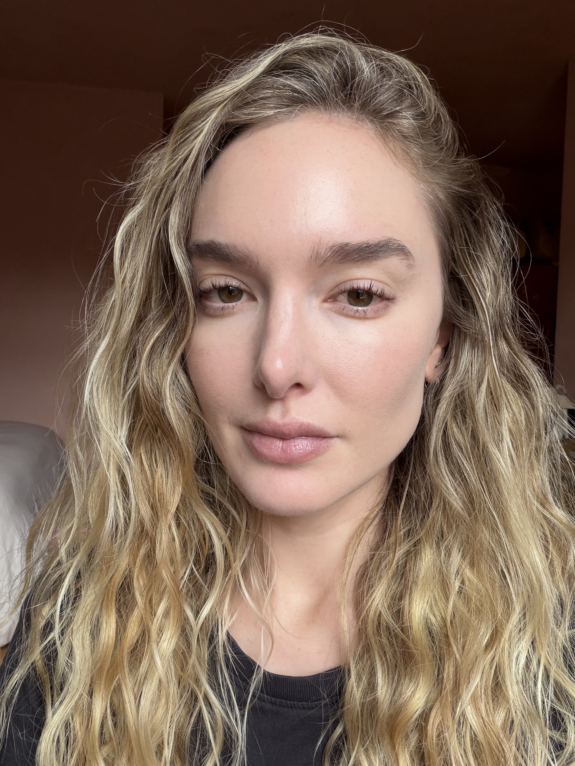 a blonde woman wearing a black t shirt