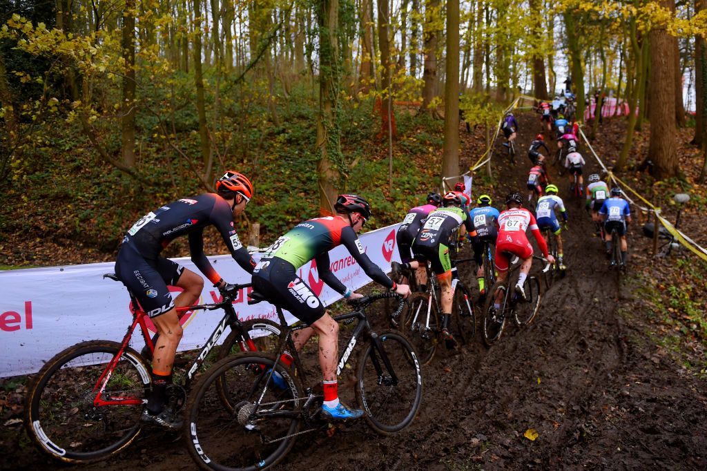 ANTWERPEN BELGIUM DECEMBER 13 Hugo Jot of France and Ardennes Cross Team Wout Vervoort of Belgium and Team IkoCrelan Bart Artz of The Netherlands and Orange Babies Cycling Team Robin Alderweireld of The Netherlands and Team Atom 6 Peloton Mud Forest Autumn Landscape during the 43rd Superprestige Cyclocross Gavere 2020 Men Elite Superprestige2021 SPGavere SuperprestigeCX on December 13 2020 in Antwerpen Belgium Photo by Luc ClaessenGetty Images