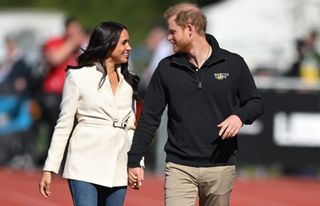 Prince Harry, Duke of Sussex and Meghan, Duchess of Sussex attend the athletics event during the Invictus Games at Zuiderpark on April 17, 2022