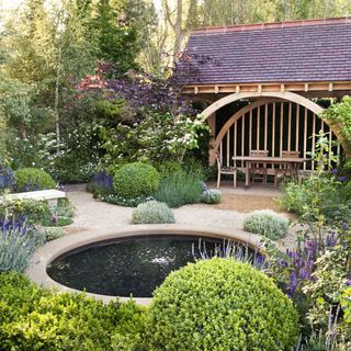 gardena area with ponds and table and chairs