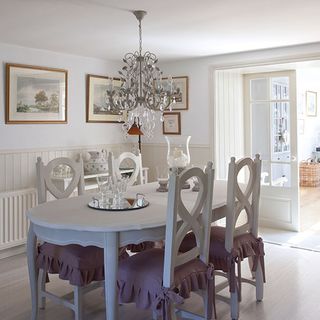 dining room with dining table and chairs with chandelier