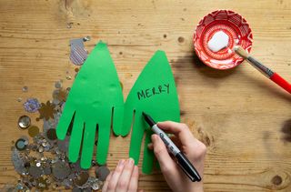 Write your message inside the handprint Christmas tree card