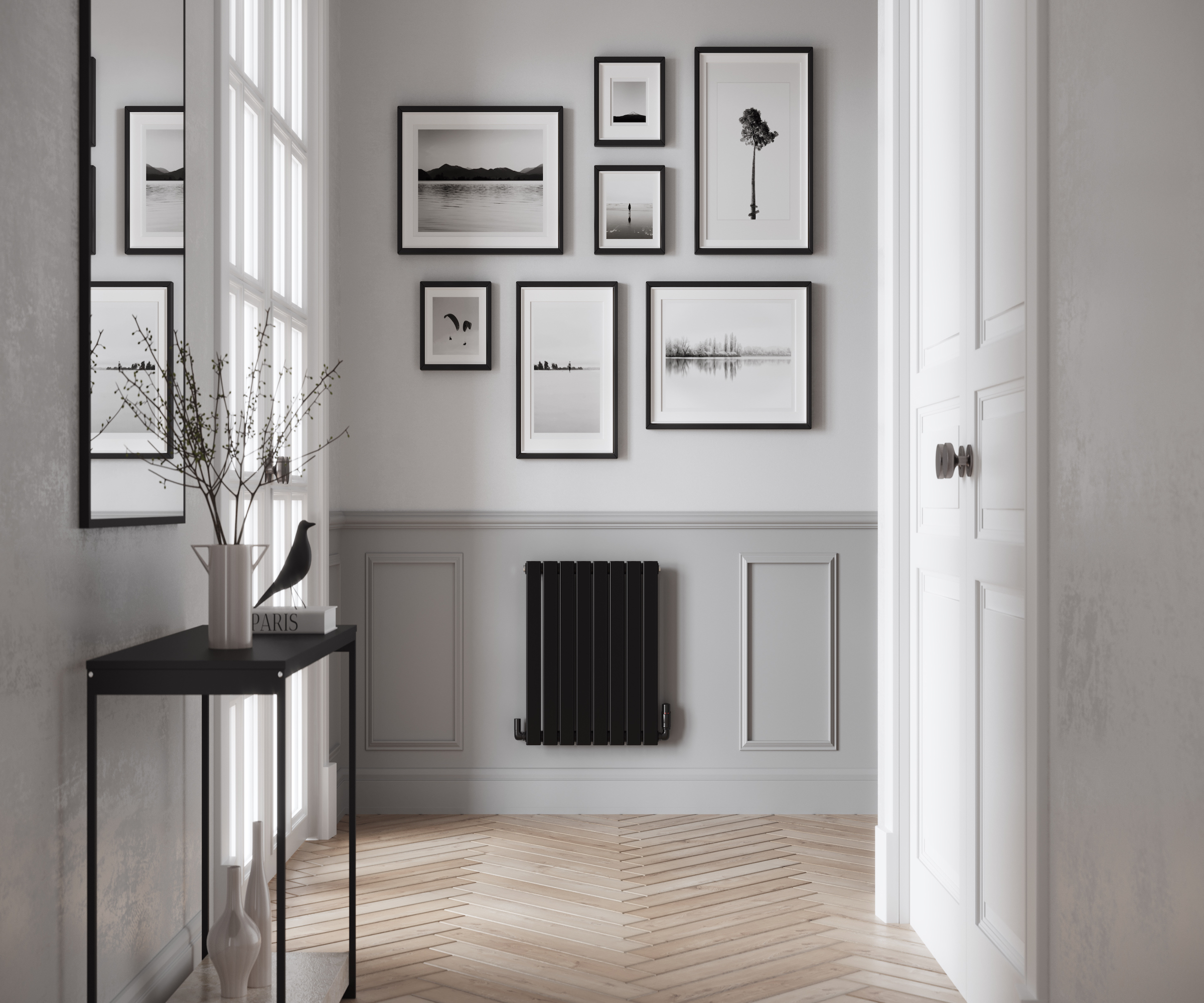 Black single panel radiator in a white hallway with light grey panelling